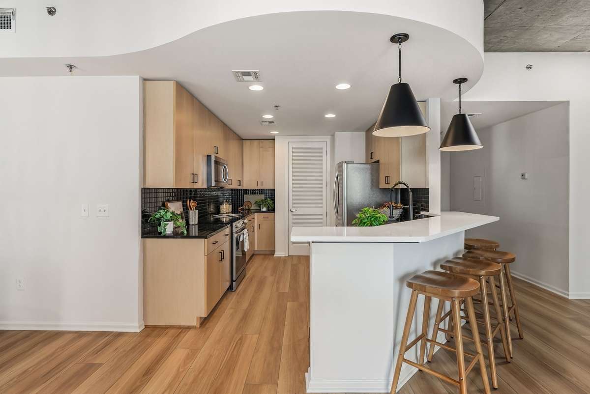 Kitchen featuring new lighting and countertops