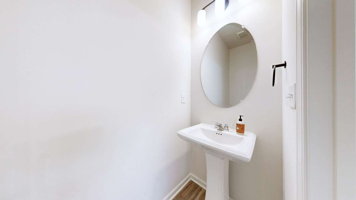 The half bath on the first floor is conveniently located for guests.