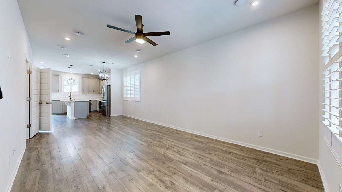 Open and airy with stylish flooring and fixtures.  Upgraded Plantation shutters and beautiful raised panel doors.