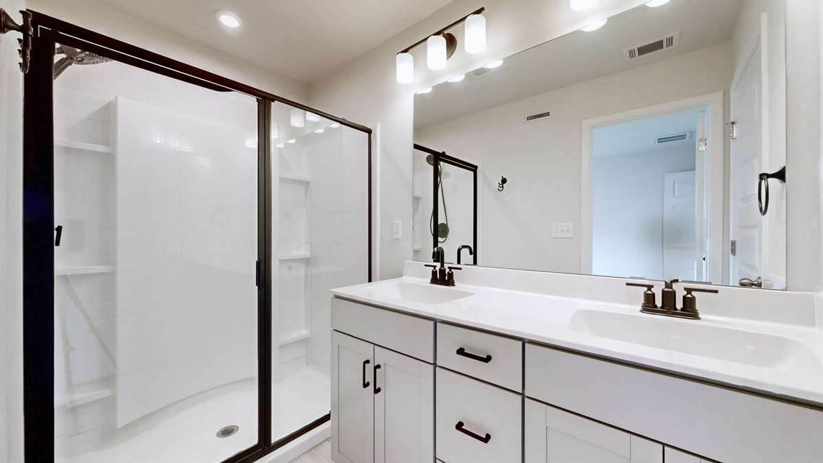 Clean and modern space... makes for a spa-like setting. There is also a separate water closet and linen closet!