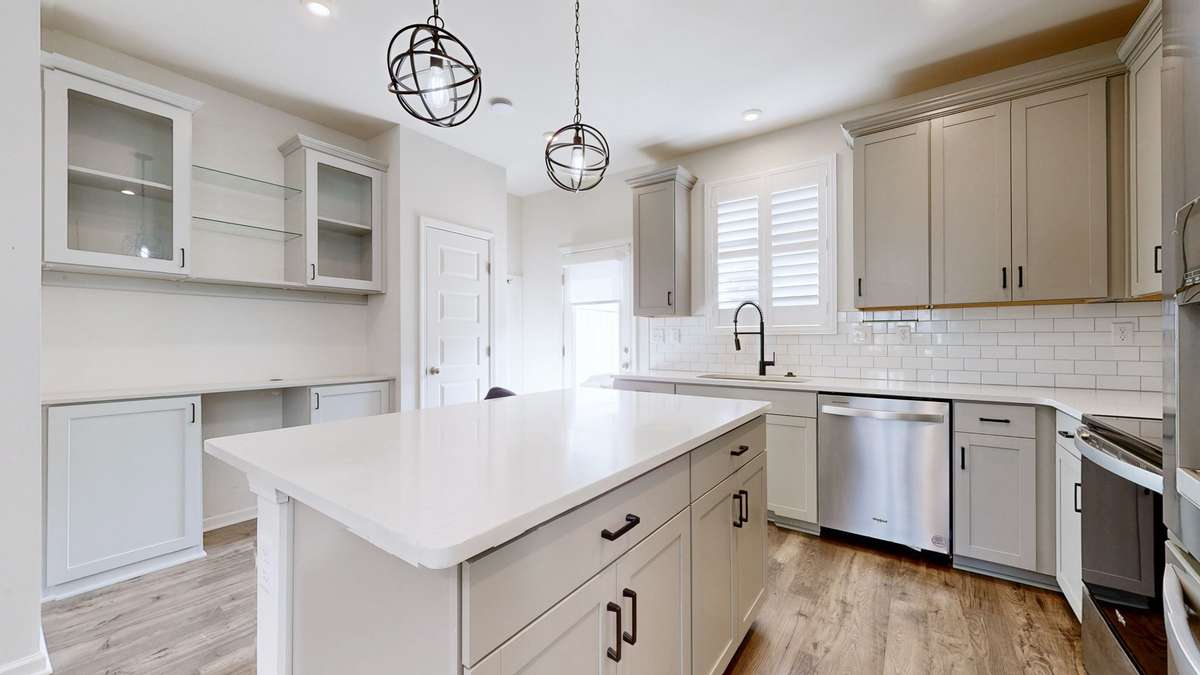 Wonderful storage! Great upgraded workstation and cabinet area. Also, an additional built-in hall tree with a bench and organized storage next to the pantry.