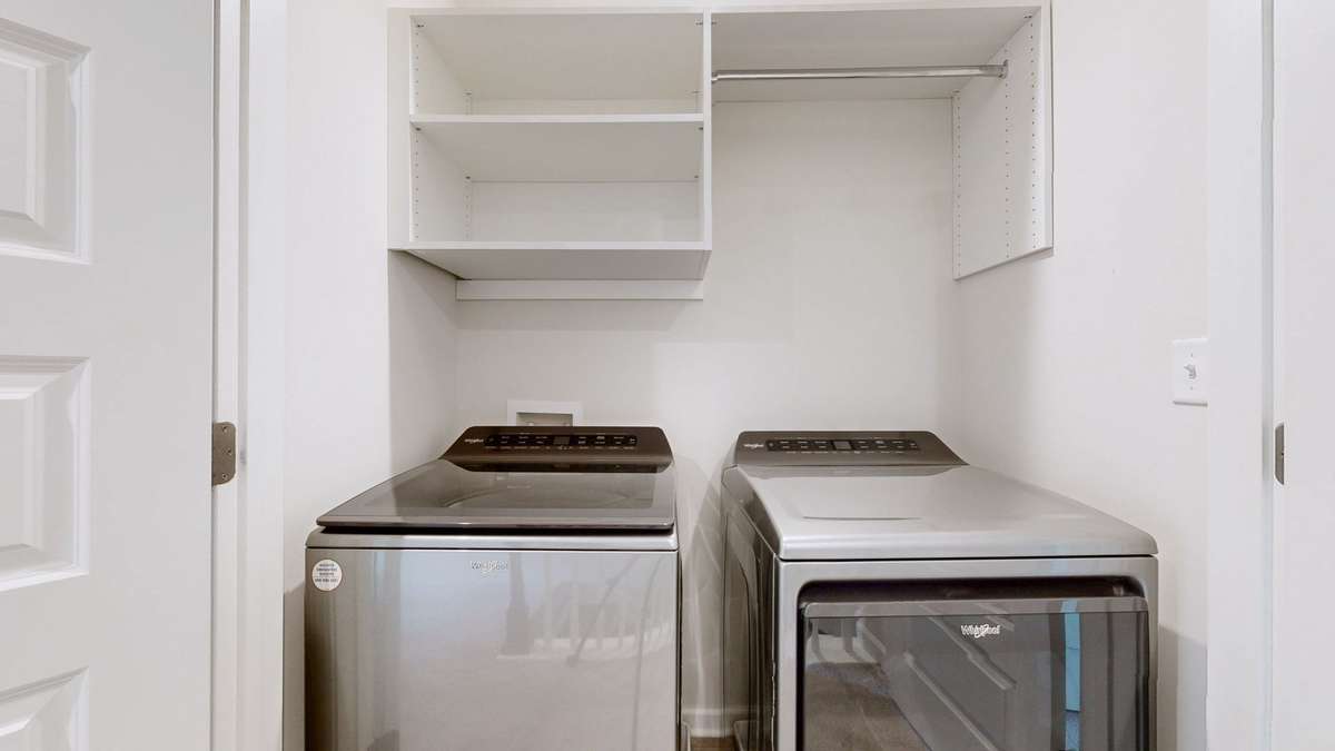 Convenient location between bedrooms in the main hallway makes laundry less of a chore.  These appliances stay as well.  Upgraded shelving in here also.