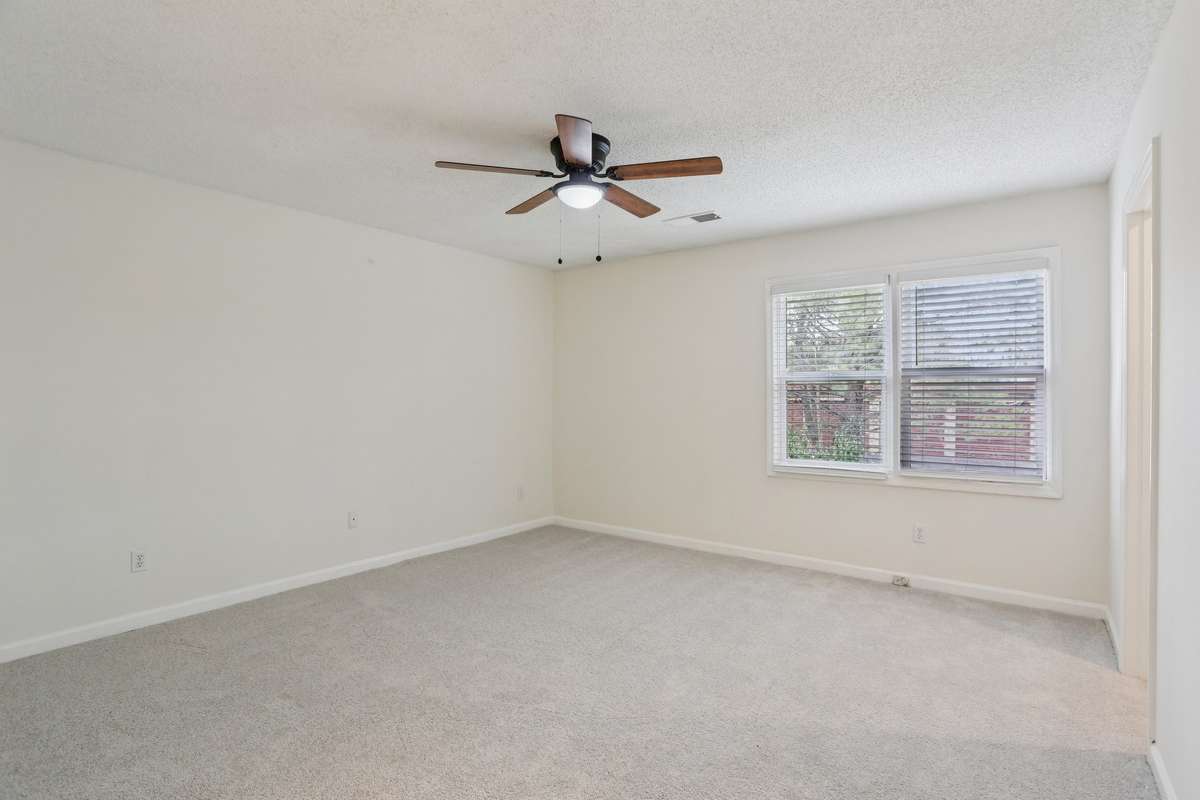 Large primary bedroom has allot of wall space & will accommodate a king size bed.