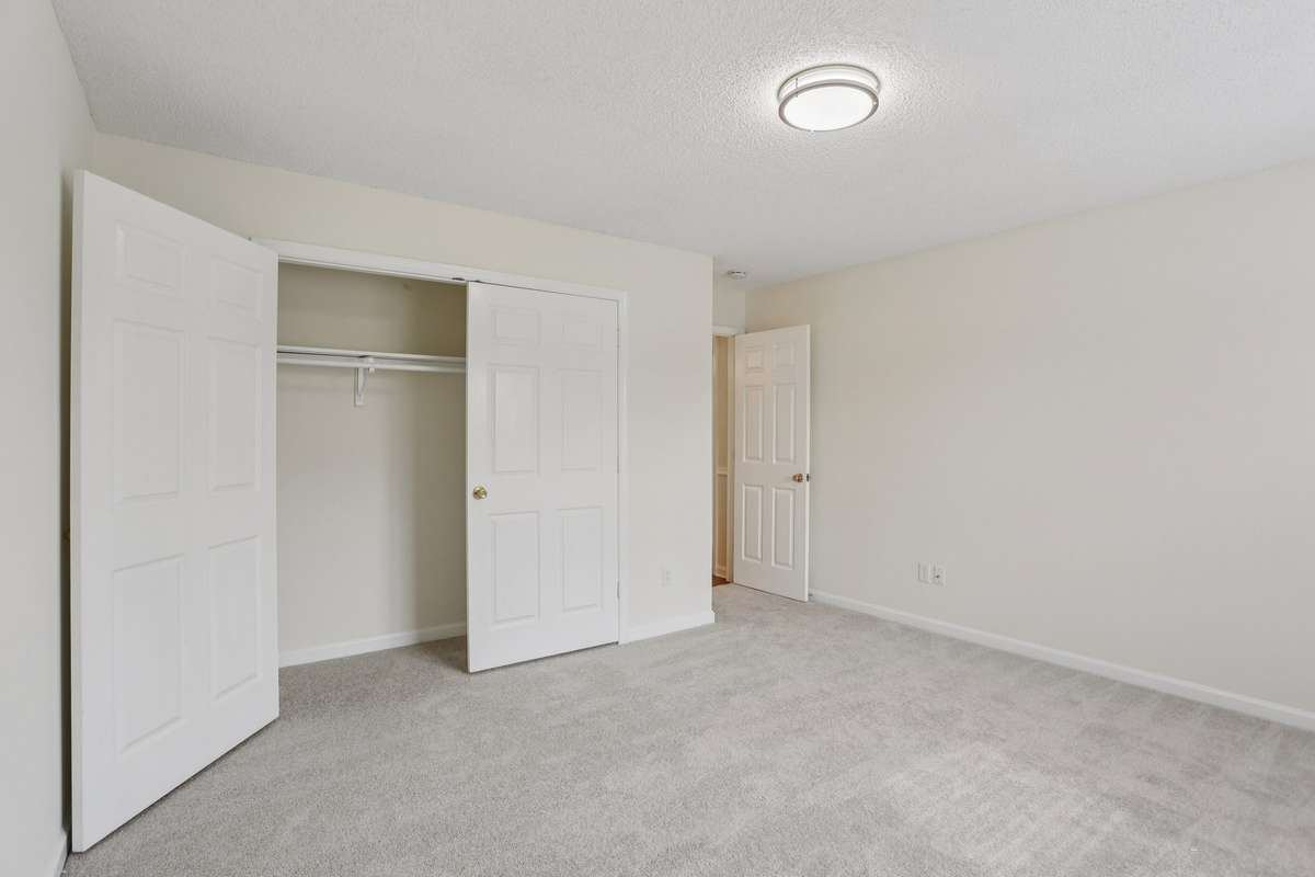 Large secondary bedroom with wide closet. New carpet in all bedrooms.