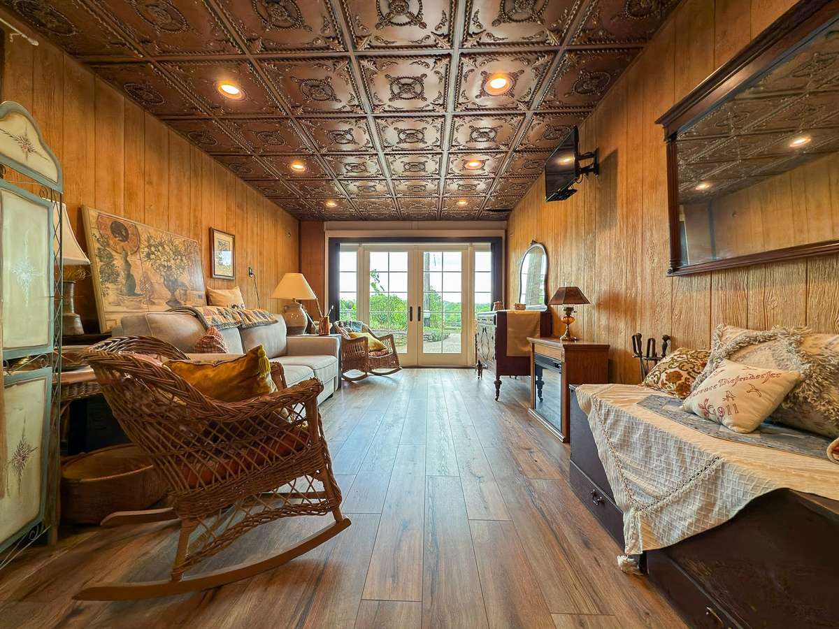 The detached guest apartment also features this private space with walk out doors (and integrated privacy screens!)