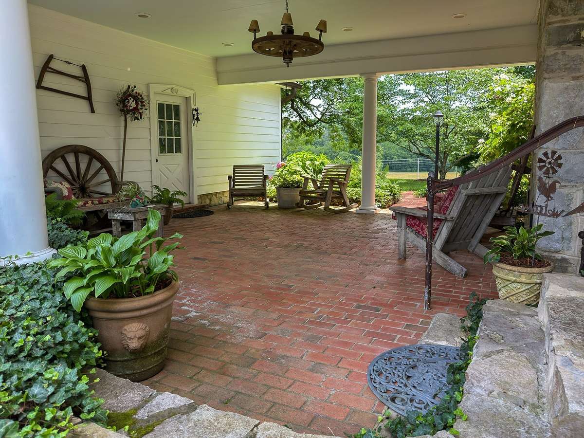 This lovely breezeway connects the garage to a convenient main home side entrance...