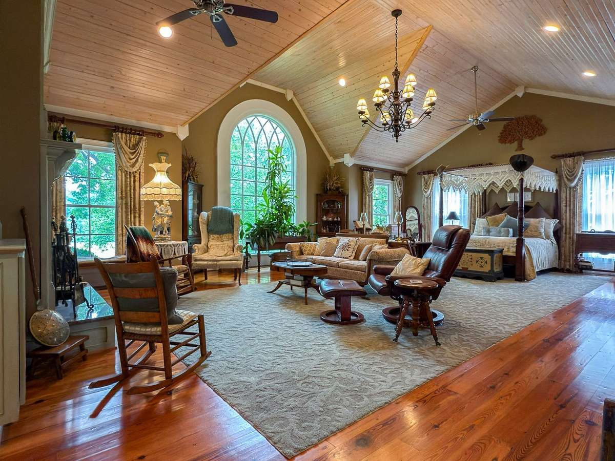 This stunning primary suite (on the main level) will take your breath away! Walk into this real-life fantasy with its own gorgeous ensuite and salon sitting area with fireplace...abundant storage too, featuring two walk-in closets...