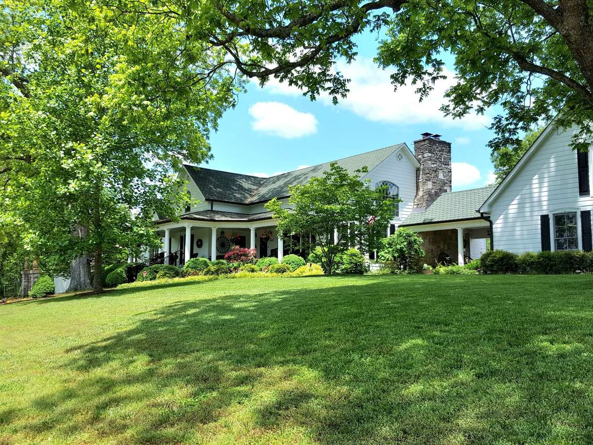 This ELEGANT and impeccably maintained HISTORIC JEWEL is breathtakingly beautiful...imagine coming home to THIS every day...front of house view!