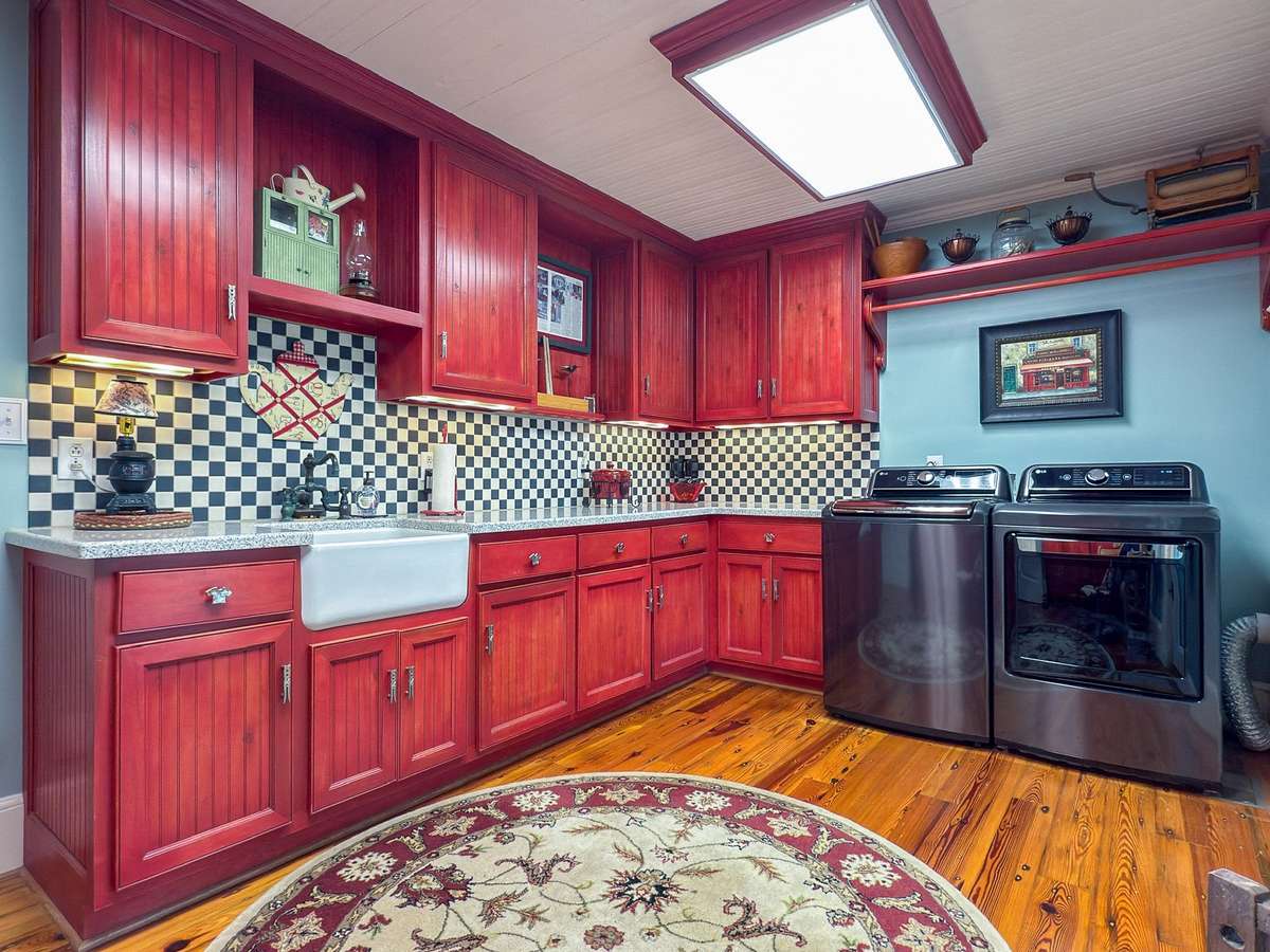 This generously-size laundry room also boasts beautiful cabinetry...such much attention to detail everywhere you look...
