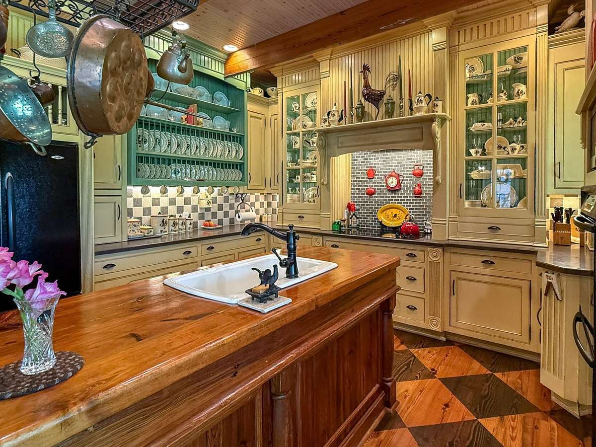A closer look at the kitchen's gorgeous craftmanship...wonderfully functional and innovative design lending a vintage charm, but with all the modern conveniences!