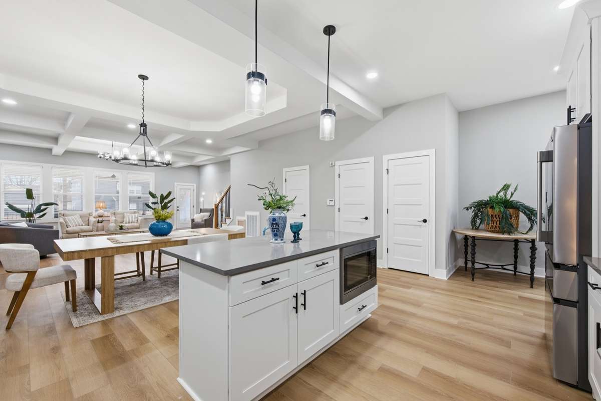 The Kitchen boasts a pantry and storage closet. A half bath serves guest in the living area.