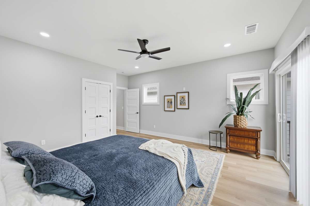 So much natural light with your abundance of windows!  Ceiling fan light fixtures can be found in every bedroom.