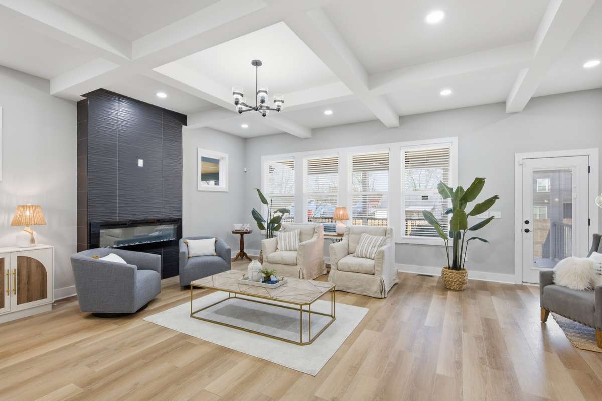 Enter your great room...beneath the beautiful coffered ceiling.