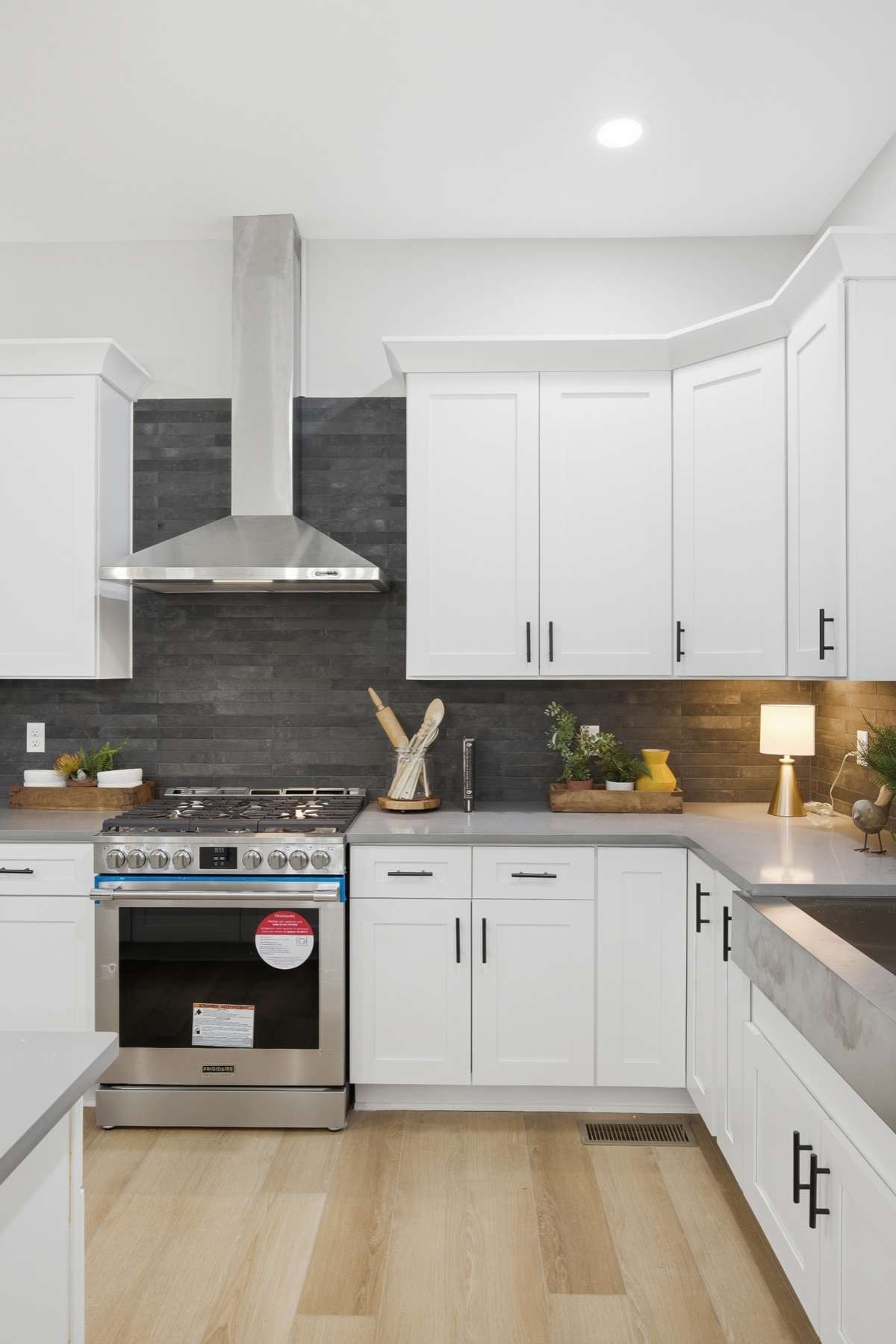 Tiled backsplash compliments the kitchen beautifully.
