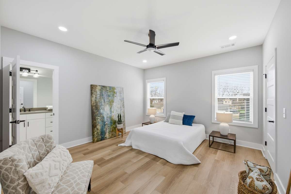 Bedroom 2 is large and sunny! The en-suite bedroom has access to a full bathroom with double sinks as well as a walk-in closet with built-ins, of course!