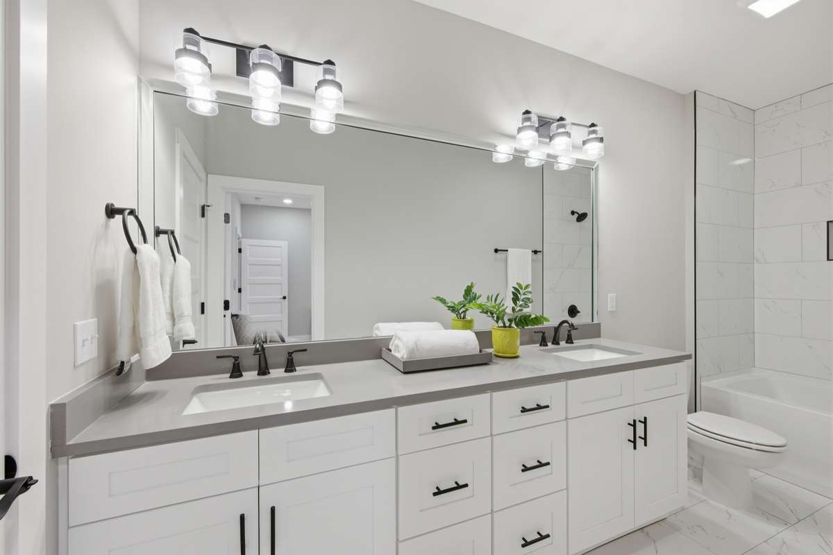 Spacious and functional, this bathroom serves both guest bedrooms upstairs.