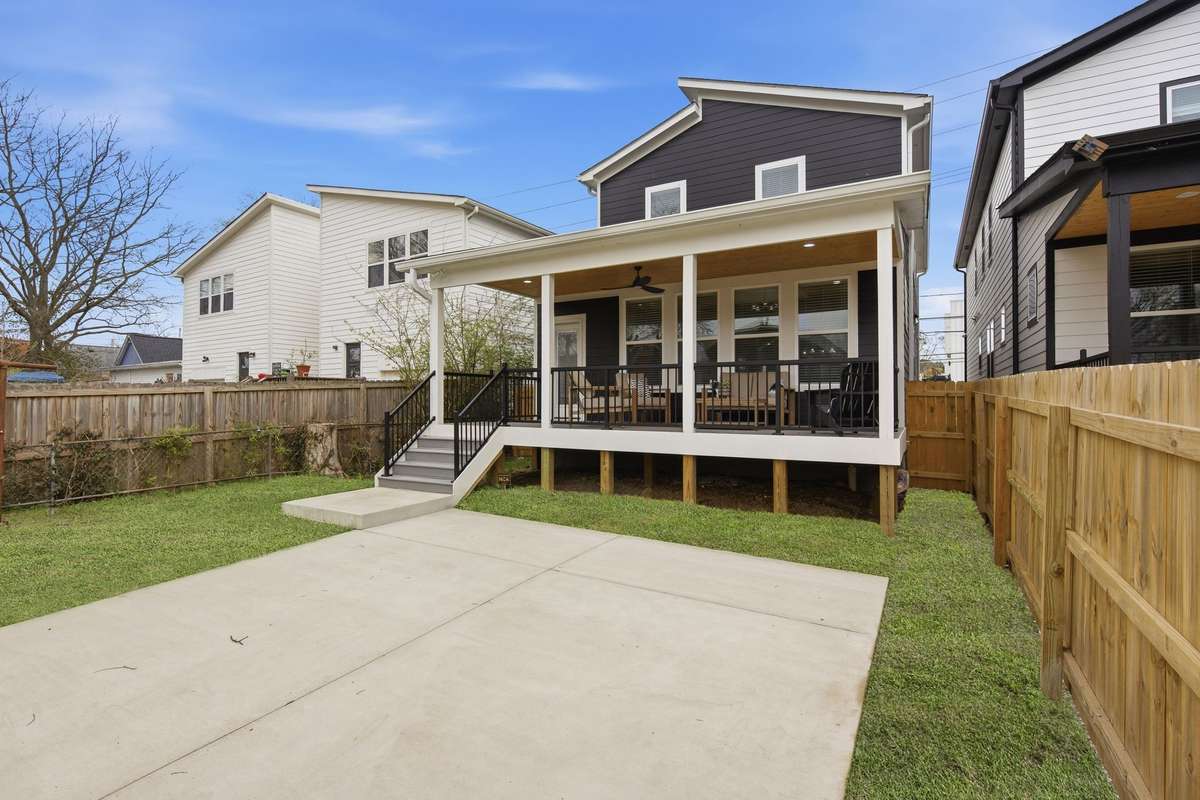 A privacy fence wraps your backyard.  Note the numerous windows and glass rear door - amazing for letting the sunlight flood into your great room.