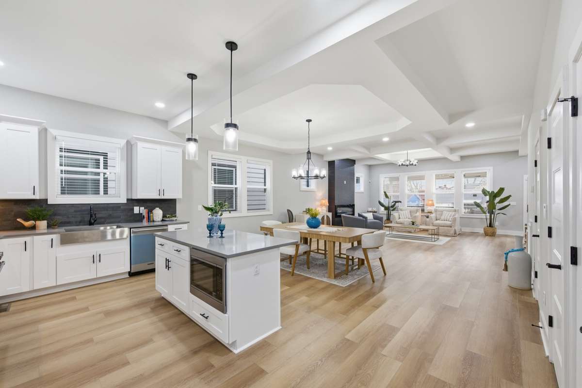 Just look at this space! Enjoy your open-concept floor plan with tall ceilings, luxurious finishes, and a large, kitchen island.