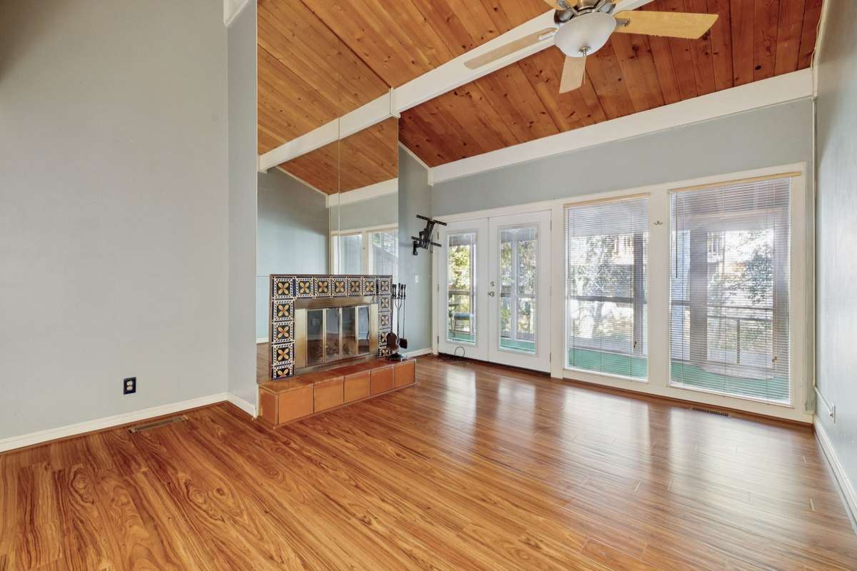 Note that hardwood floor and wood burning fireplace. Colors are now a luscious Ivory.
