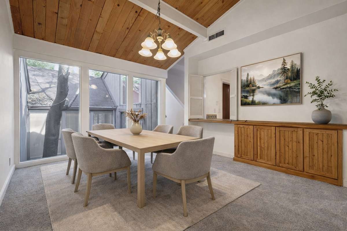 Virtual photo of Dining room area now painted Ivory with a view of private ATRIUM.