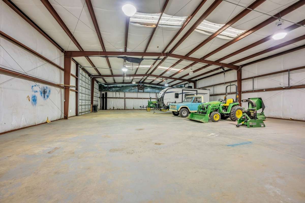 5,000 Sqft Metal Building with some duct work / insulation in place.