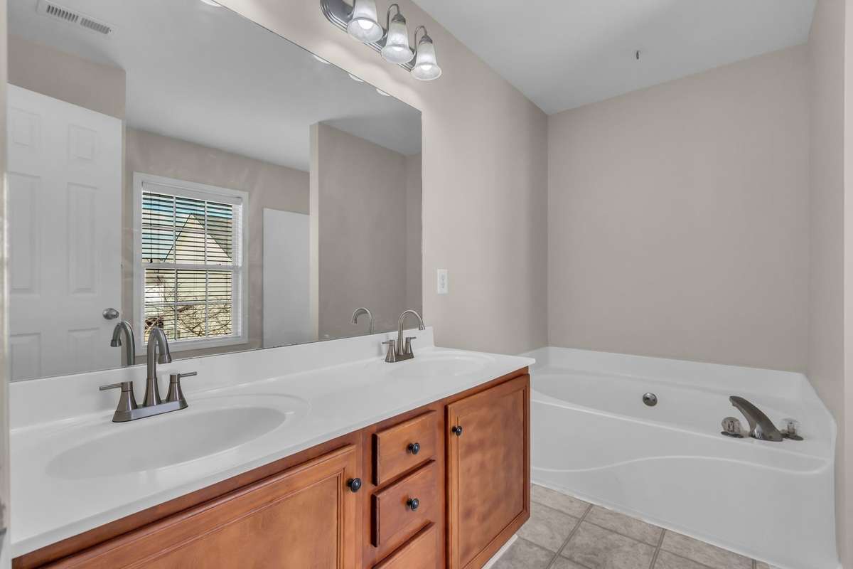 Owners suite bathroom includes soaking tub