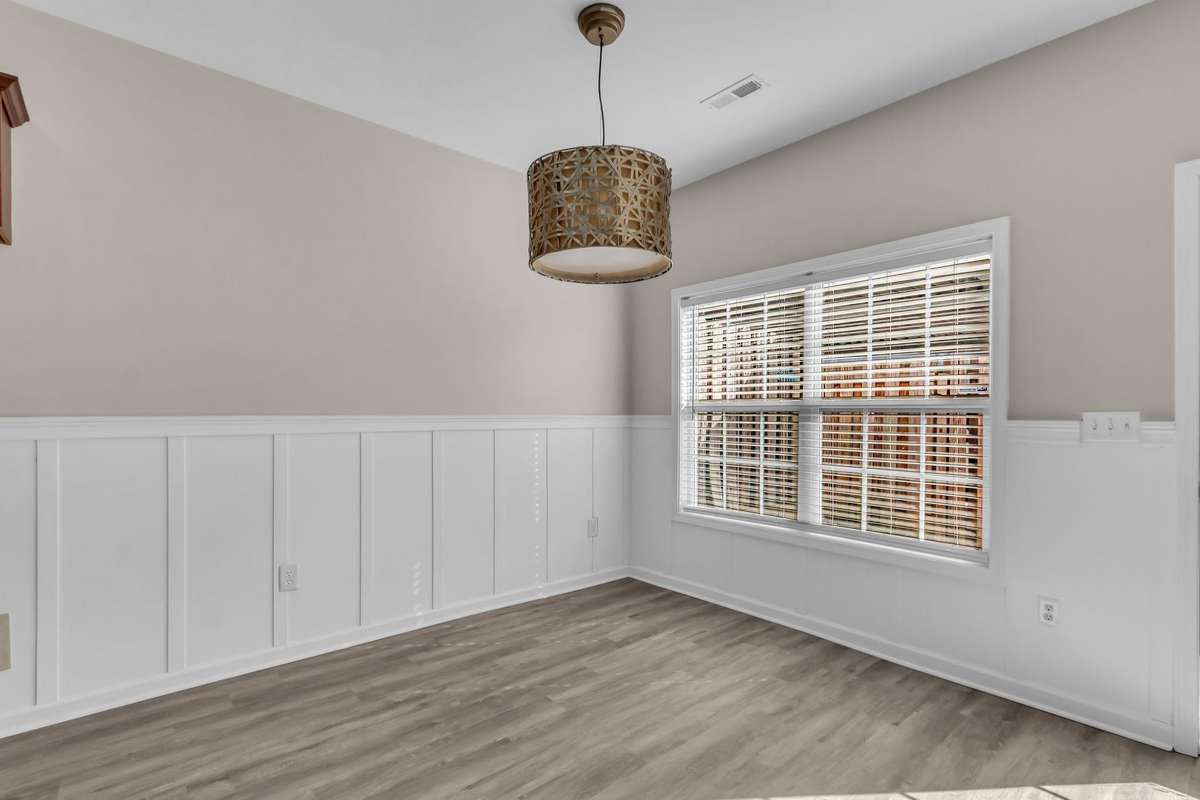 Updated light fixtures and wainscot in eat-in nook
