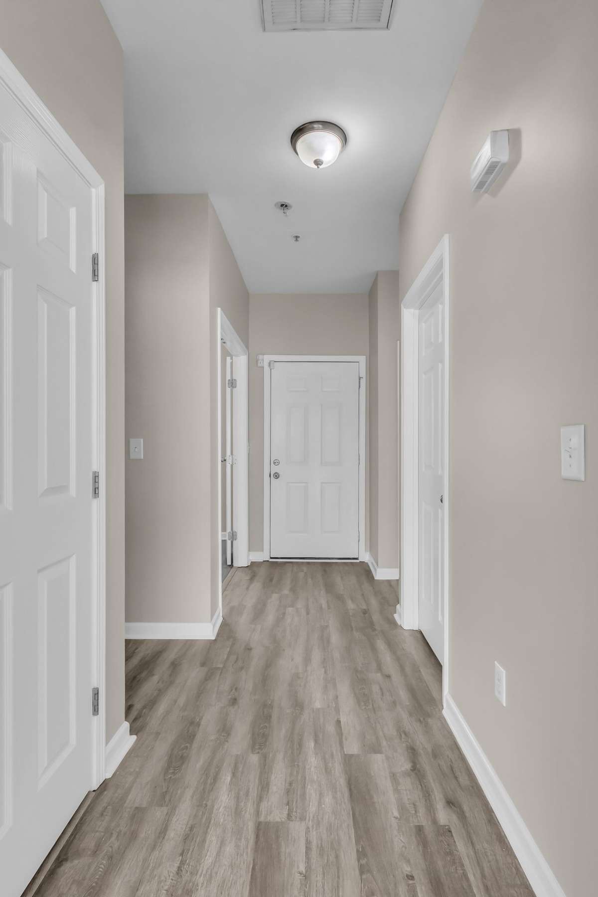 Hallway leading to office and half-bath