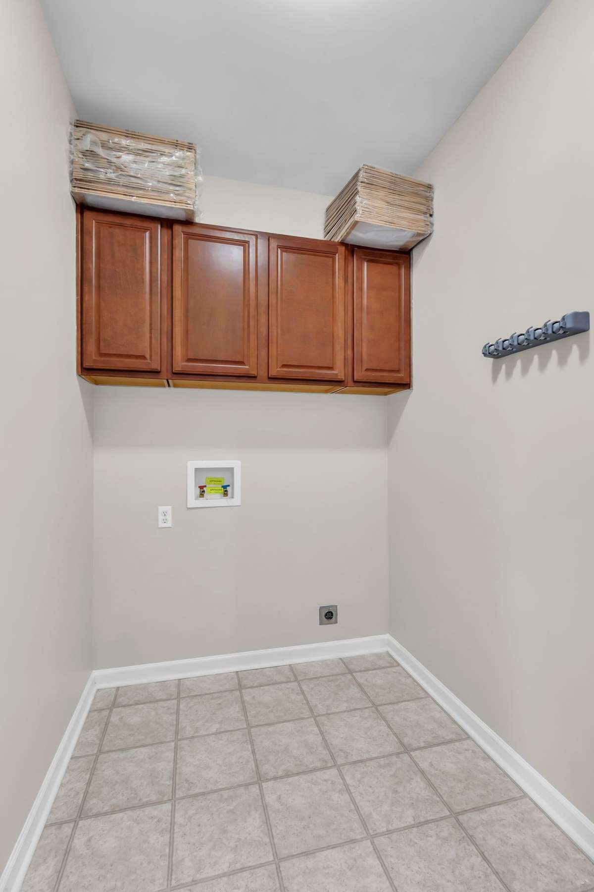 Main floor Laundry Room, with Washer/Dryer Hookups, Cabinets, Seller is leaving some air filters for the new buyers