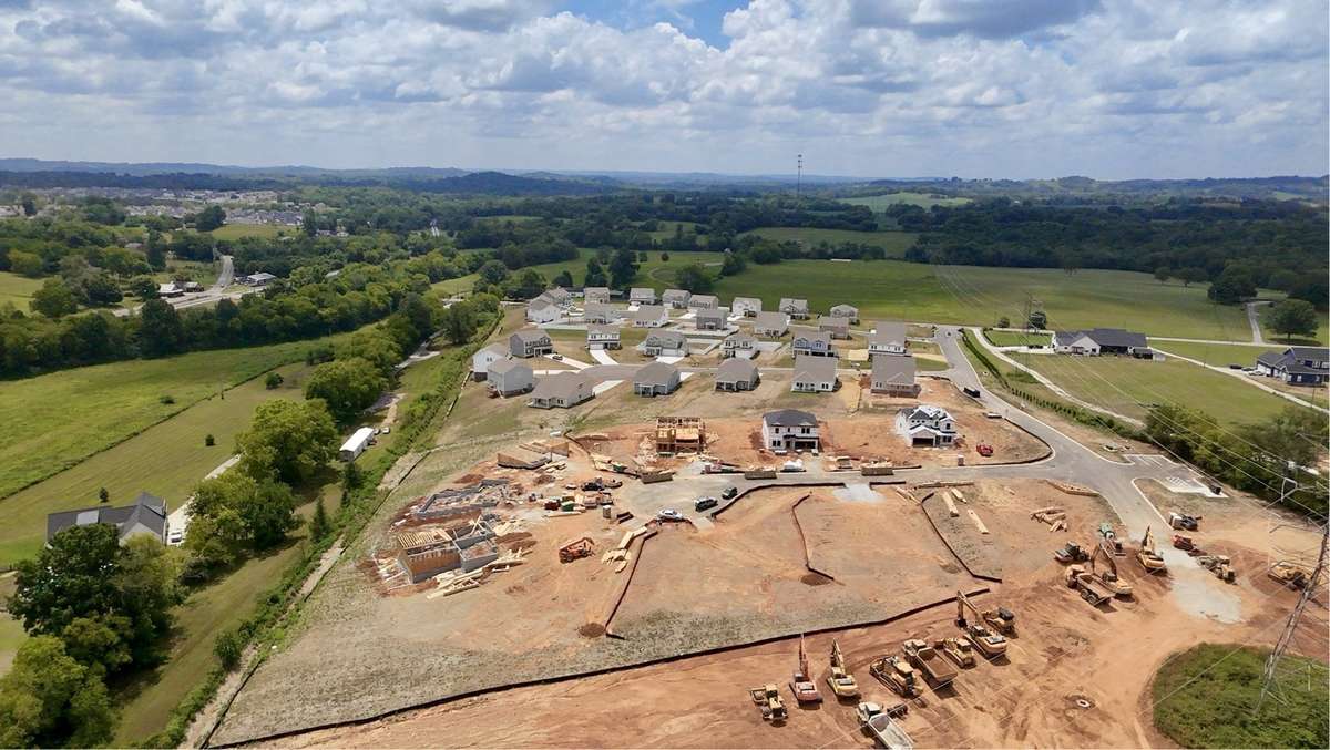 Bird's-eye View of The Reserve at Silver Springs Phase II. Highlighting expansive homesites, scenic surroundings, and ongoing new home construction.