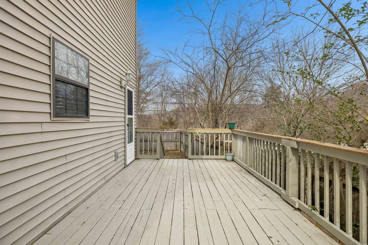 Large deck accessed from the kitchen has been recently reinforced underneath so it's ready for your summer gatherings! 7701 Poplar Ridge Drive, Nashville, TN 37221