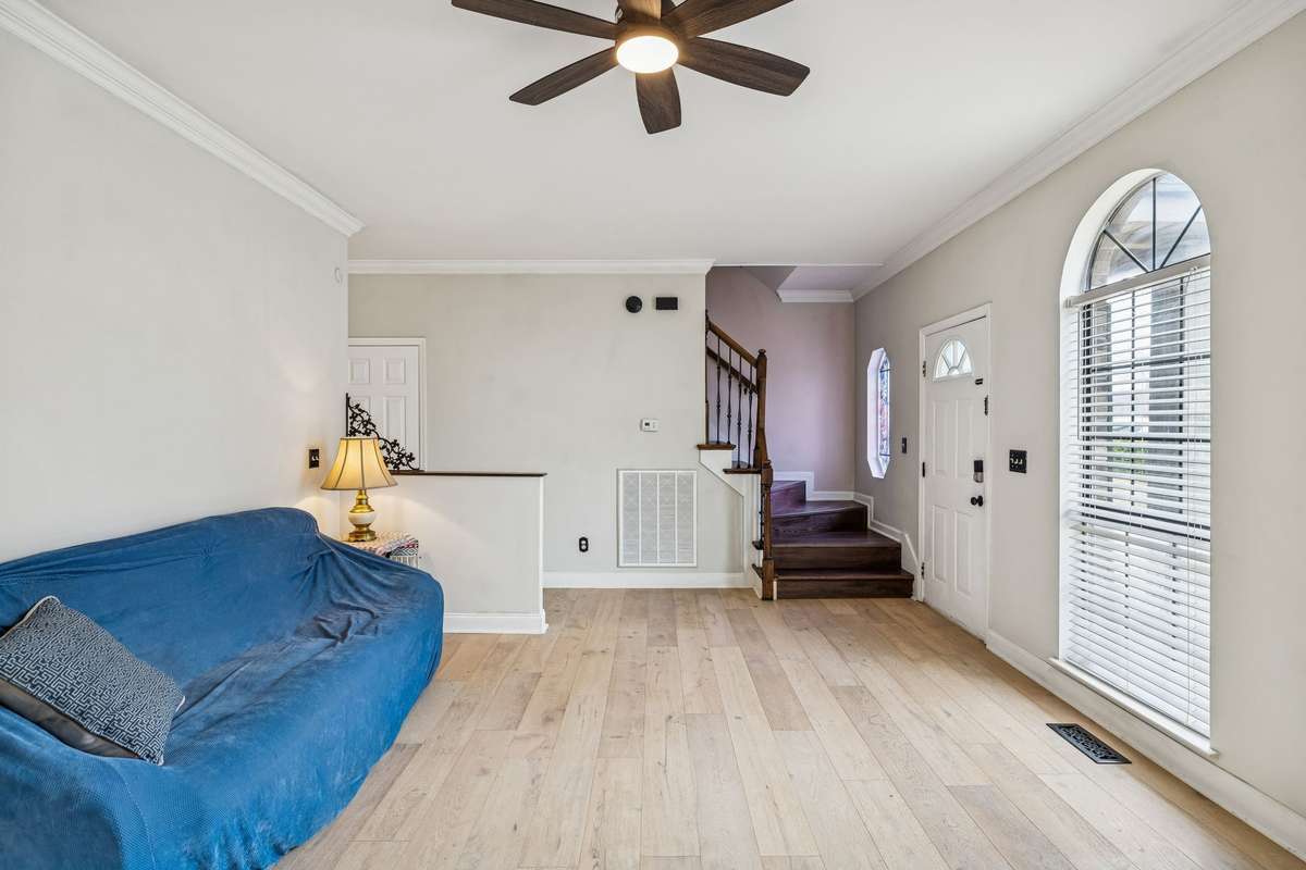 Light and bright living room is flooded with natural light from large arched windows! 7701 Poplar Ridge Drive, Nashville, TN 37221