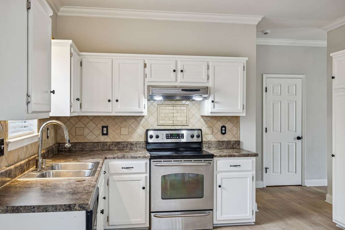 Crown molding with fresh, white cabinetry, and neutral paint scheme make this a standout space! 7701 Poplar Ridge Drive, Nashville, TN 37221