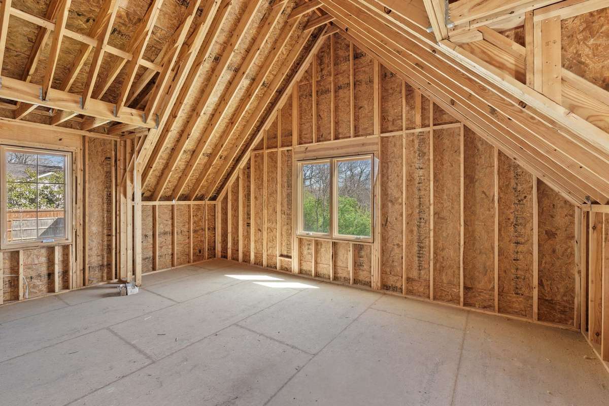 Unfinished space above garage offering additional square footage