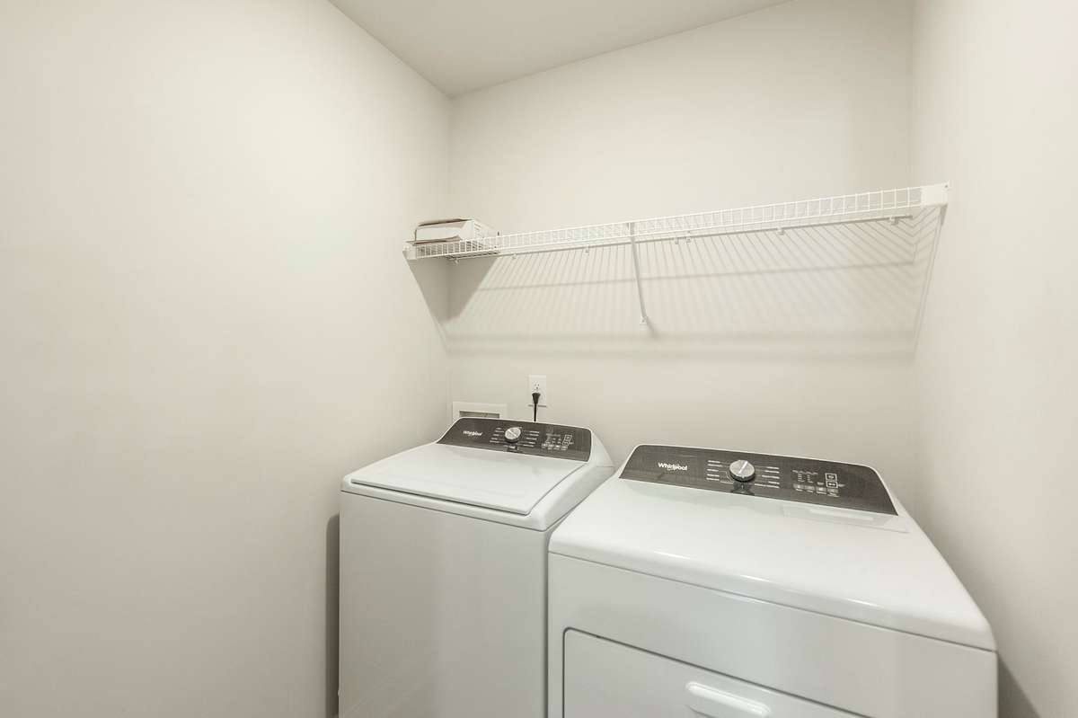 Laundry room conveniently located upstairs