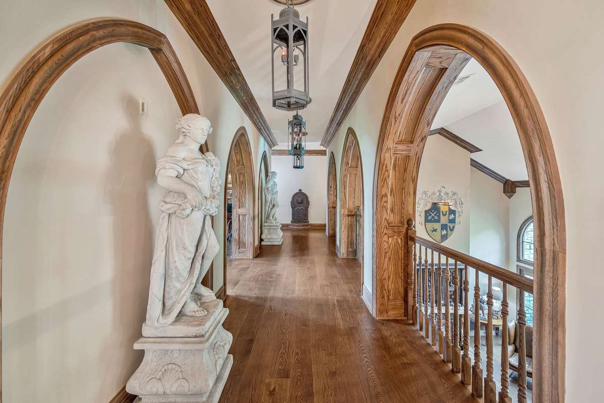 Upstairs the arched hallway guides you to two spacious bedrooms each with its own private en-suite bathroom. Its a moment of elegance that connects the private quarters to the rest of the home