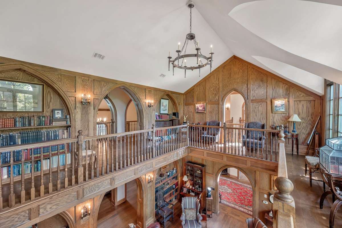 Library with arched bookshelves