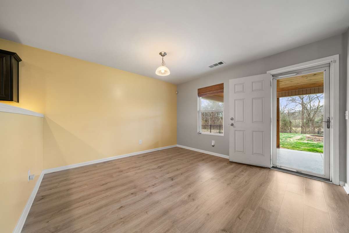 Breakfast nook with lots of natural light and leads right out to the patio.