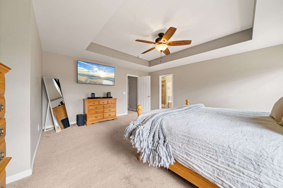 Enjoy the size of the primary bedroom with a gorgeous tray ceiling.