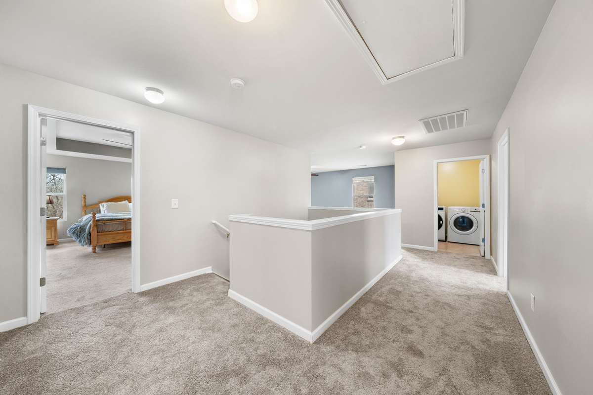 The Primary bedroom is immediately to your right at the top of the stairs, but this upstairs has much more to offer!