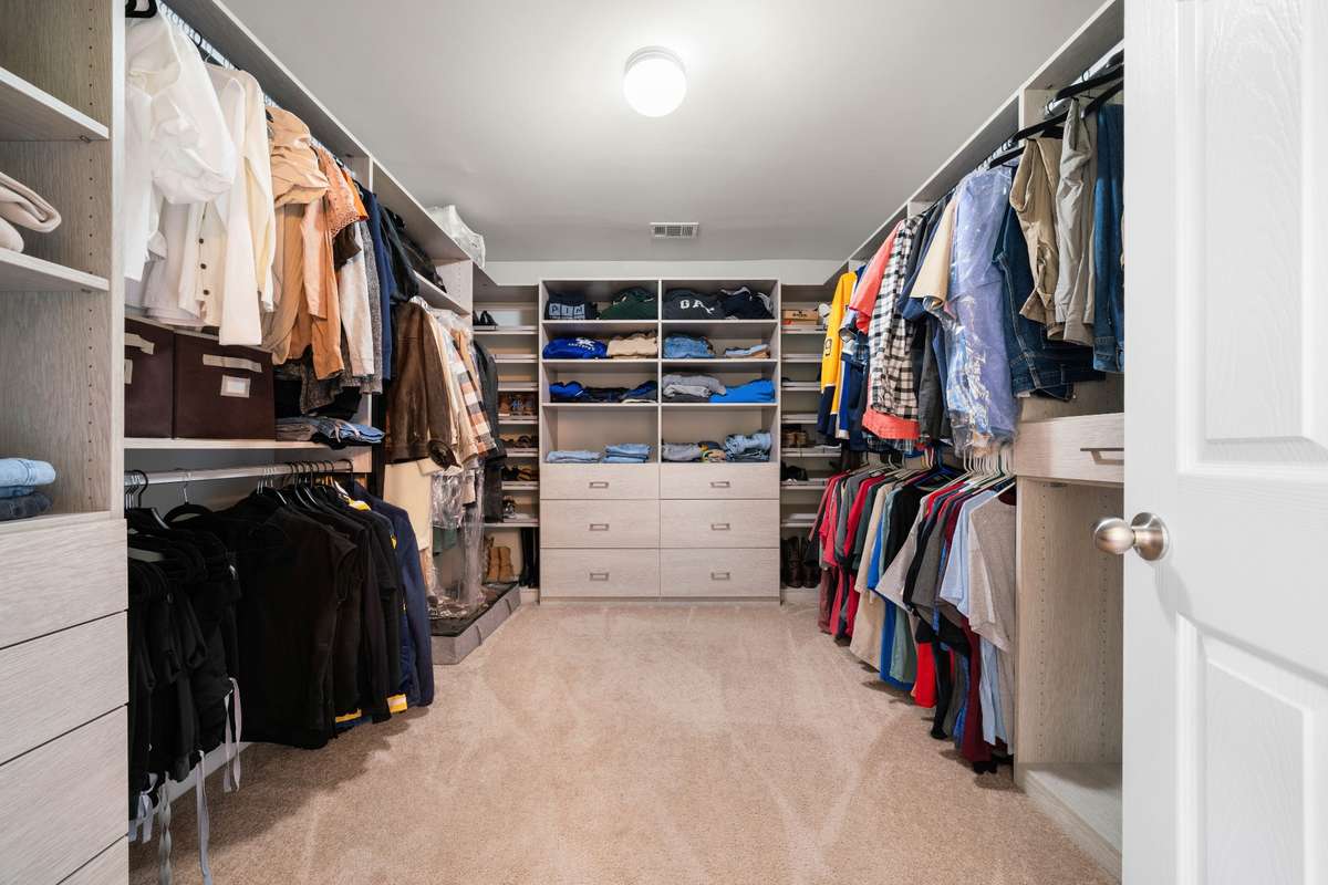 Primary Walk-In Closet: This walk-in California closet was built with plenty of storage in mind!