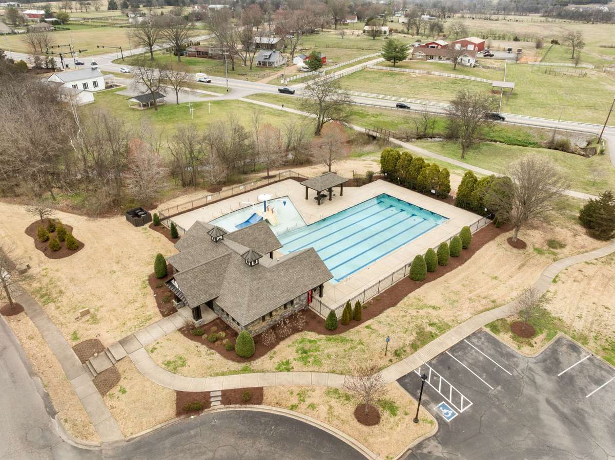 Amenities Include:Junior Olympic Pool with Children's Splash Zone, Cabana, Monument, Community Green Space