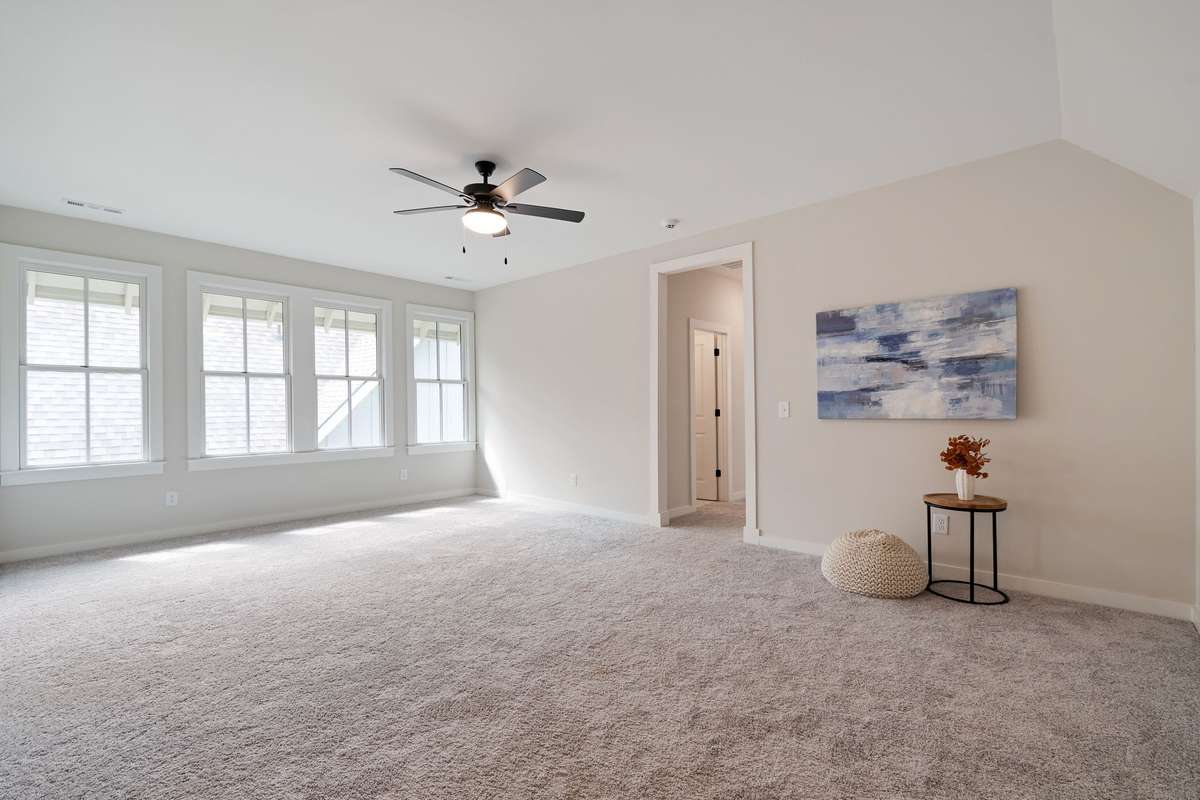 This common space could be divided into a fourth bedroom.