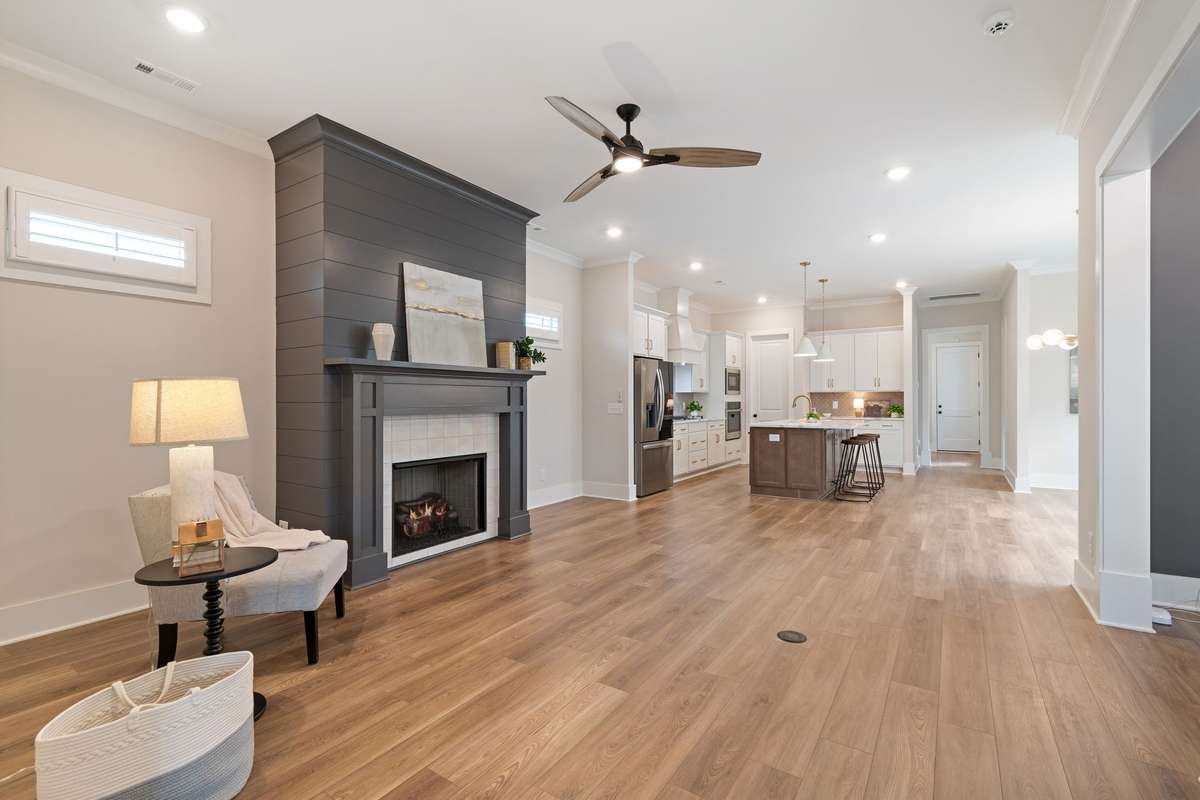 The great room offers a beautiful fireplace as a centerpiece which gives focus to setting up the room with furniture.