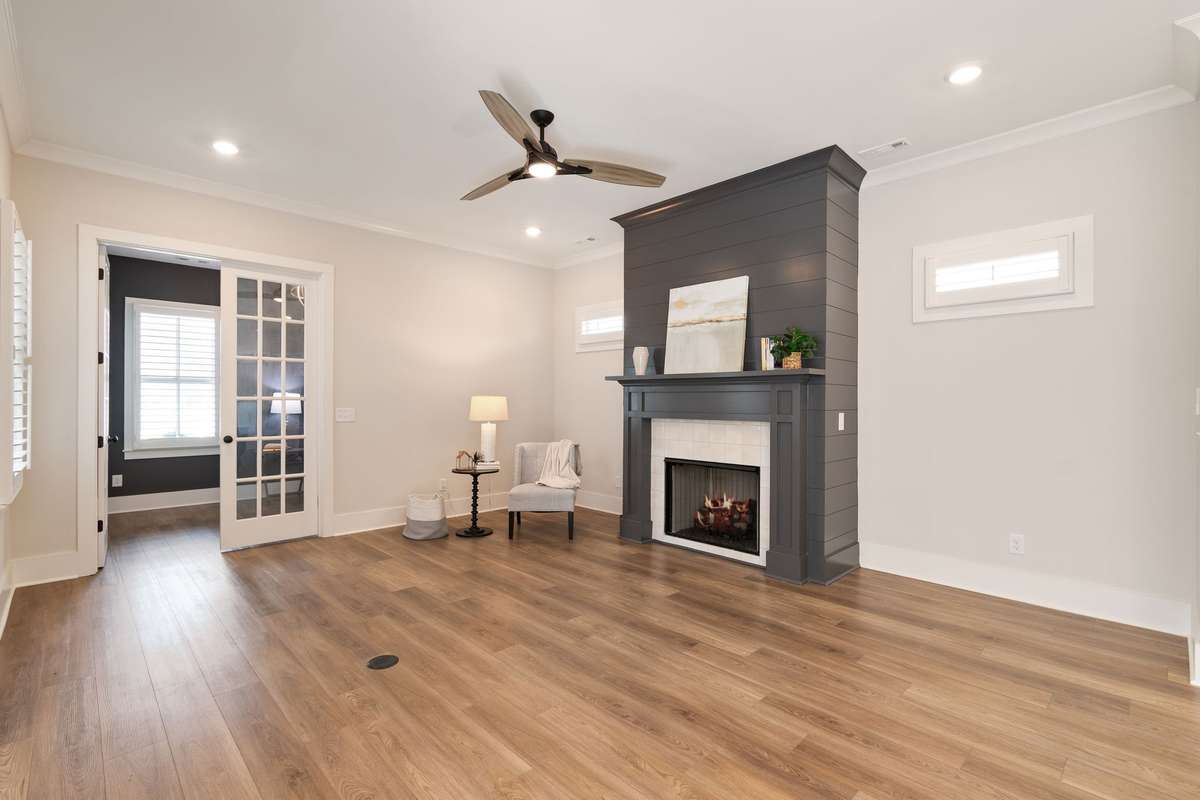 The great room opens to a private office/music room/formal living room space. 18-lite French doors offer light and privacy.
