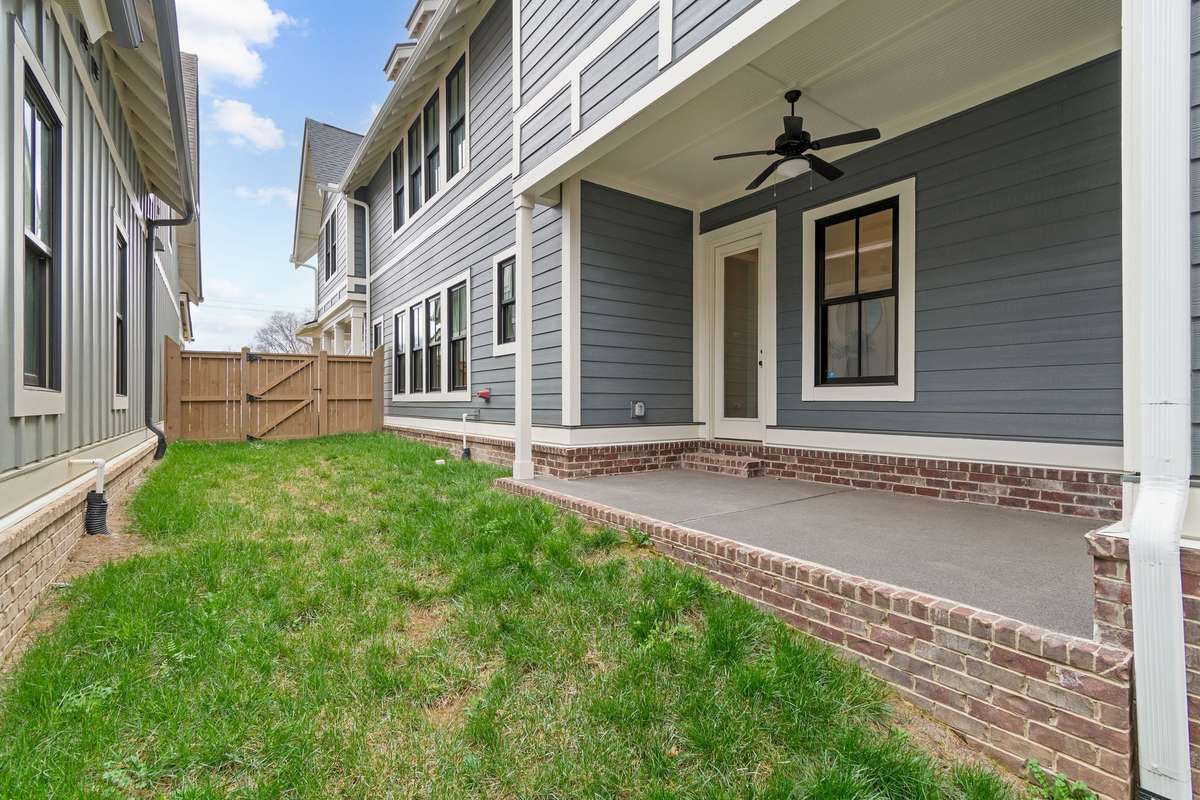 This home offers a covered patio and private green space for outside entertaining.