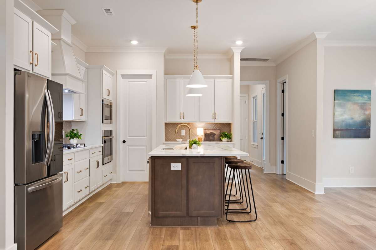 On the far wall there is countertop space which is perfect for a coffee bar. Very convenient for storage of your kitchen must haves!
