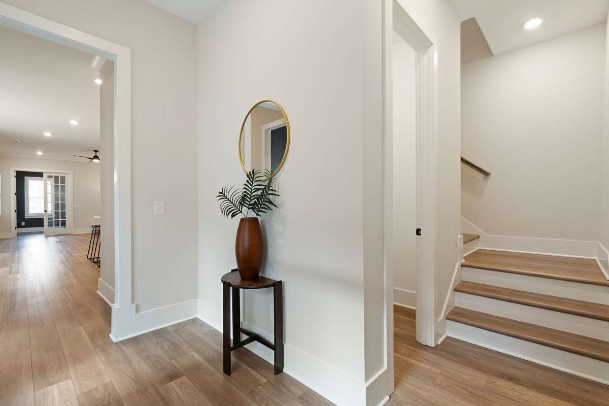 The rear staircase leads to three bedrooms and two full baths