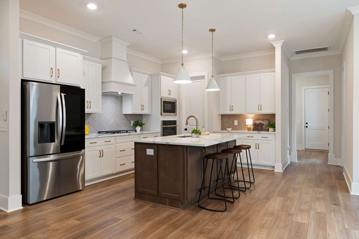 The kitchen is the heart of the home. This spacious kitchen offers room to cook and the large island with extra cabinets is a lovely place for afternoon projects, morning coffee or dinner with the family.