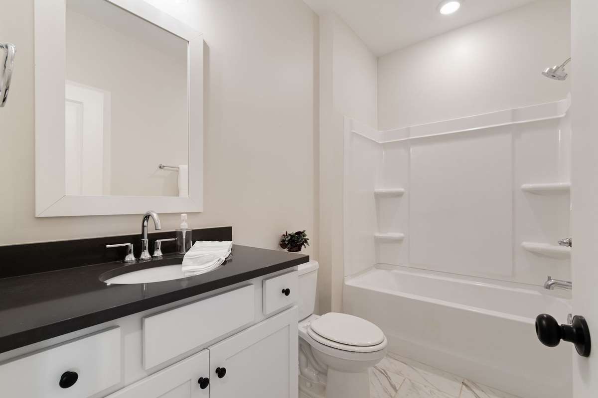 The upstairs bathroom shared by the second and third bedrooms.